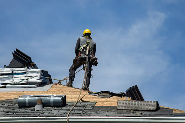 Professional Roofing technician working in Nellis, WV